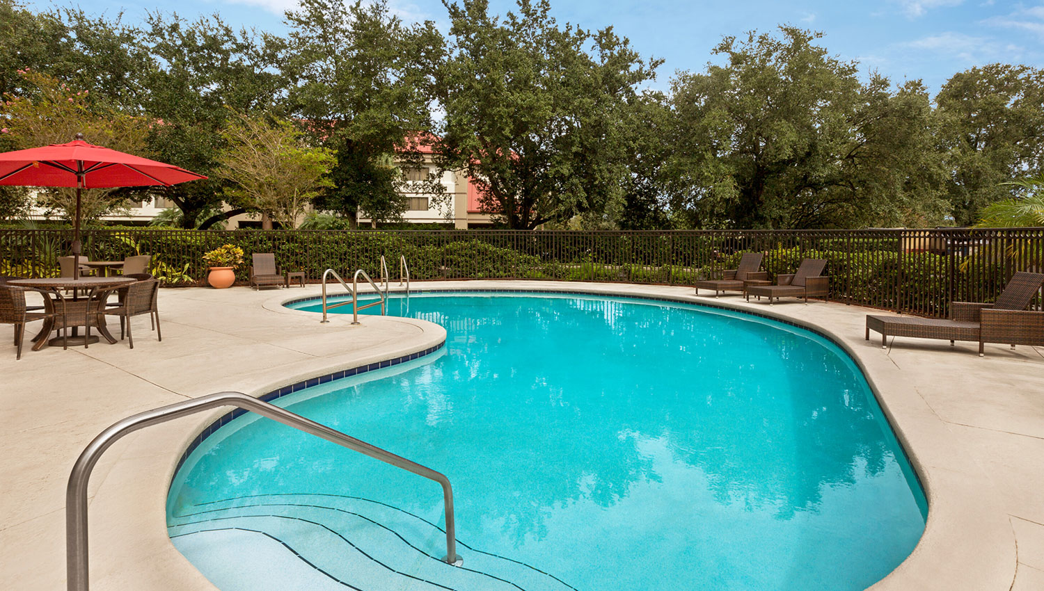 cool down in our outdoor pool after using the onsite fitness center
