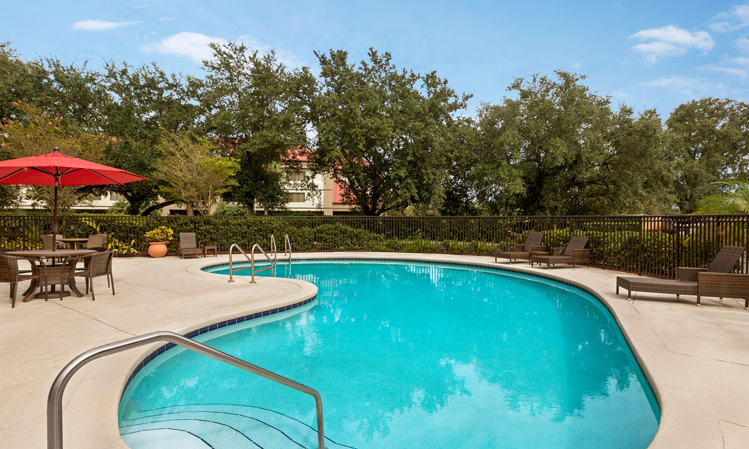 staying refreshed using our gym and our outdoor swimming pool